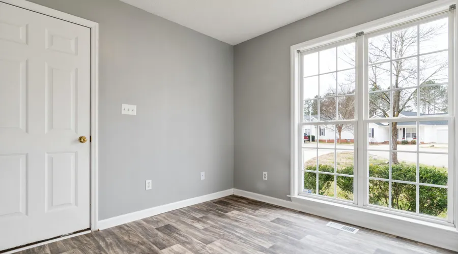 What Is Acrylic Paint? - Bright and spacious empty room with wooden flooring and large window