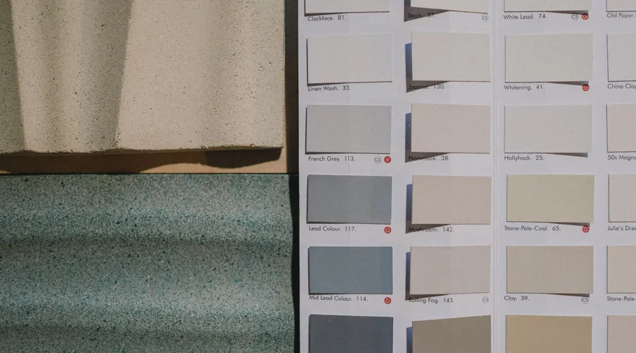 Quick Comparison: 8 Black Paints - A detailed view of paint color swatches alongside textured material samples for design inspiration