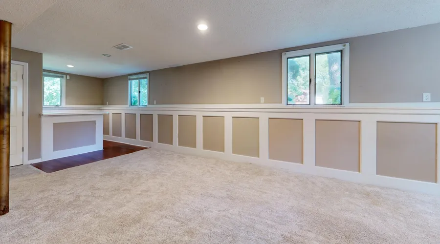 What Is Alkyd-Modified Enamel? - Bright and airy basement with ample natural light and modern decor