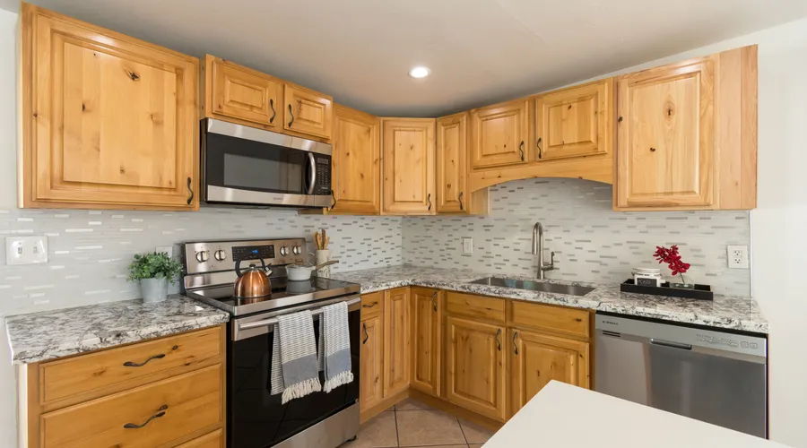 Step-by-Step Guide - Spacious kitchen with wood cabinets