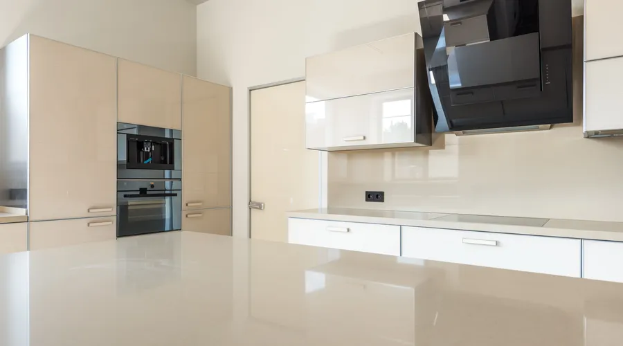 Sherwin Williams Interior Paint - Sleek and spacious modern kitchen design featuring glossy cabinets and high-end appliances